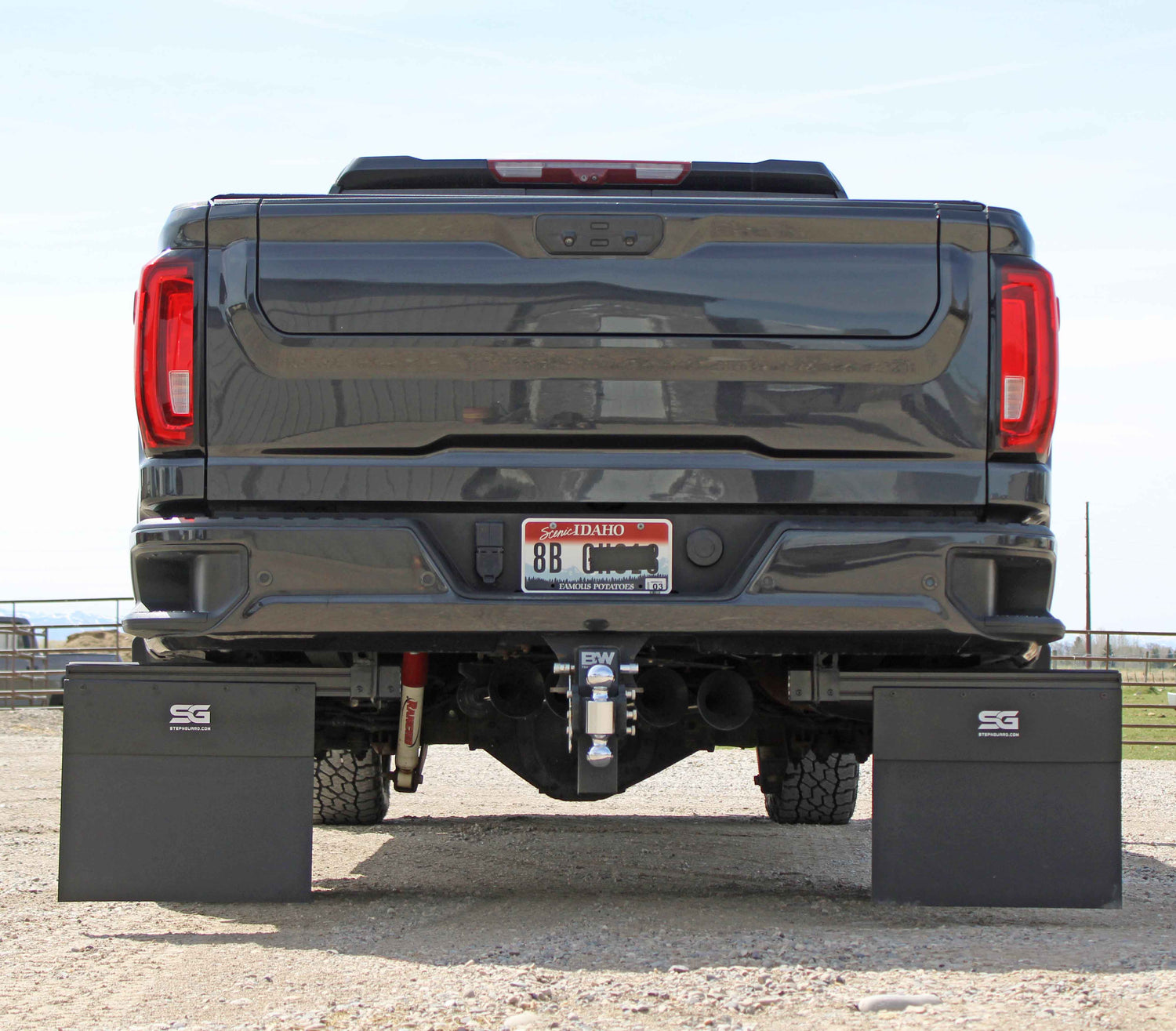 Chevy truck with mud flaps and bed step system